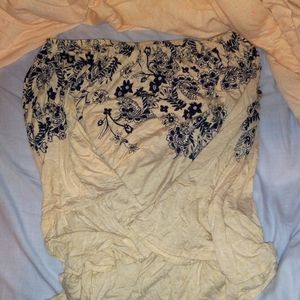 Off the shoulder creme shirt with navy flowers
